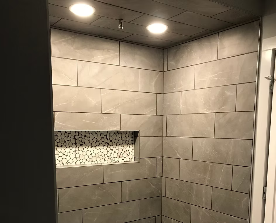 Tiled shower with recessed lighting